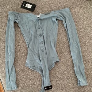 Brand new blue body suit for sale (with tickets)